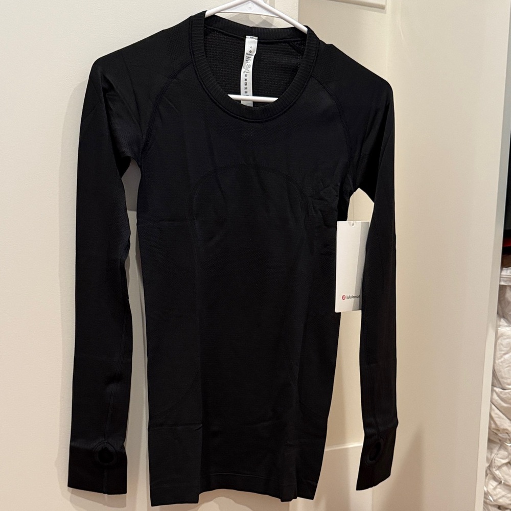 NWT- Lululemon Black Long Sleeve Swiftly Top, size 4, regular/hip length